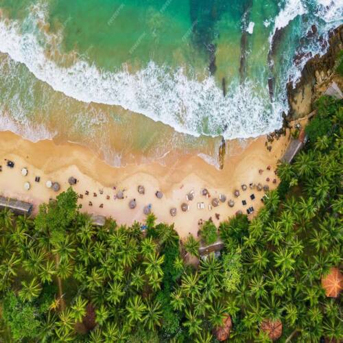 Surfer riding a Weligama beach break